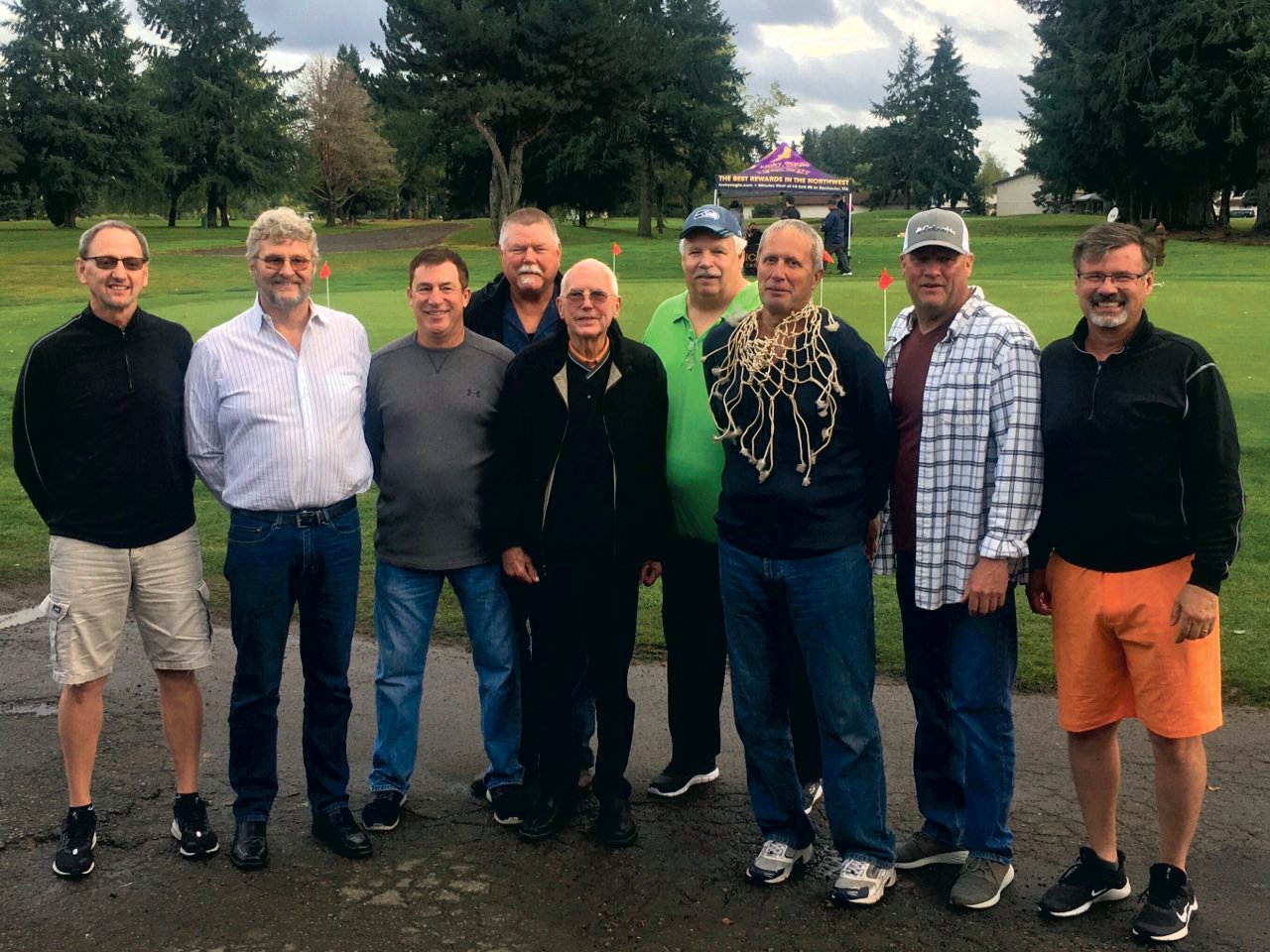 Former Centralia High School boys basketball coach Ron Brown (center) poses with members of the 1979 state champion Tiger basketball team at Newaukum Valley Golf Course during a fund-raiser golf tournament.